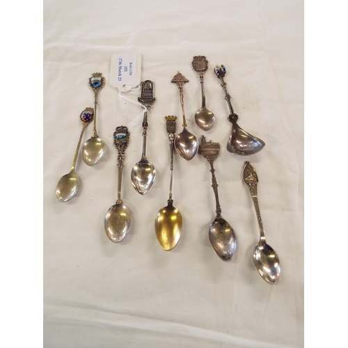 153 - Ten assorted souvenir spoons to include white metal and three 800 silver