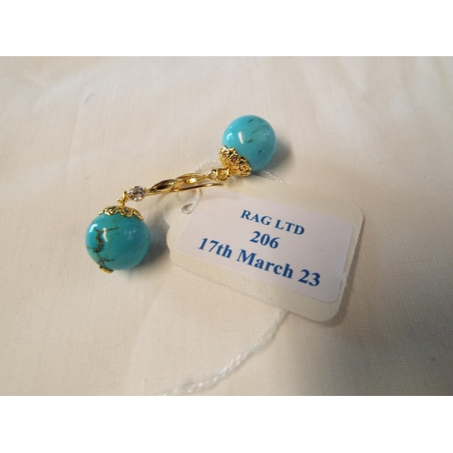 206 - A pair of natural turquoise gemstone earrings