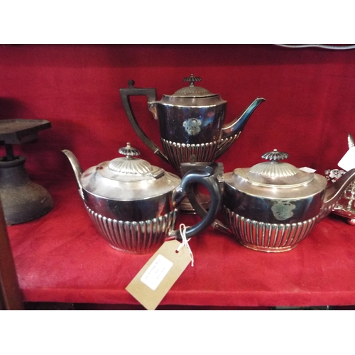 239 - Two Walker and Hall fluted tea-pots and a coffee pot