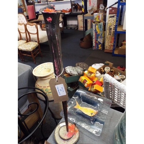 259 - A metal candlestick together with a glass dish with fish decoration