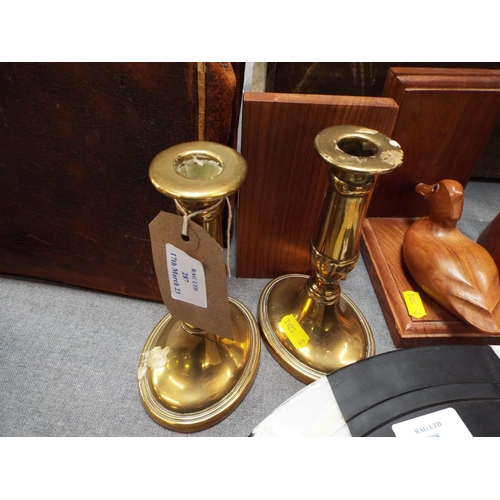 287 - A pair of brass candlesticks and a pair of wooden duck bookends