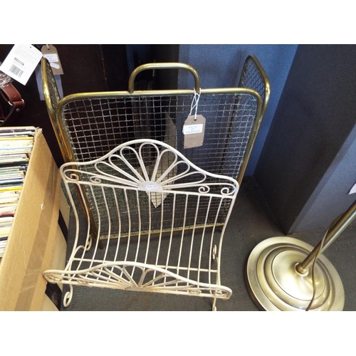 323 - A vintage brass folding fire guard together with a retro magazine rack