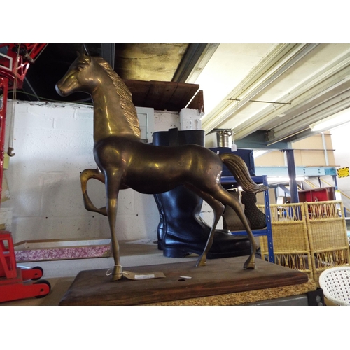 345 - A large brass horse figure on wooden stand