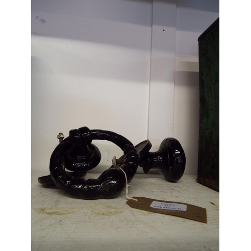 364 - A black painted iron door knob and a black painted door knocker