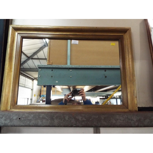 417 - A framed wall mirror