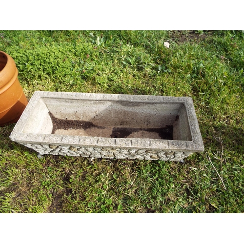 483 - A concrete garden trough with metal legs