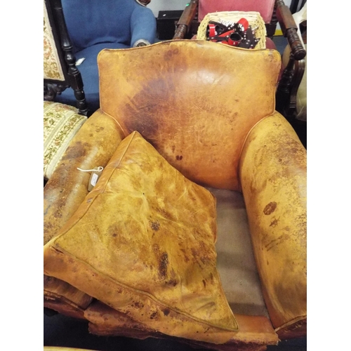 508 - A vintage tan leather armchair