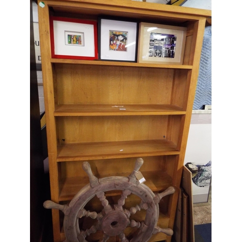 526 - A light oak bookcase having five shelves and two short drawers