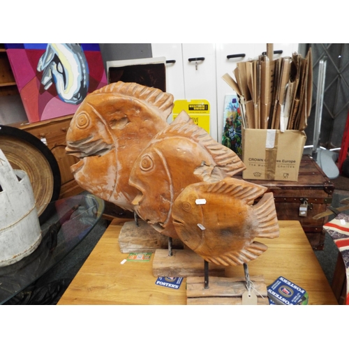 550 - A set of mid-century carved hardwood sun fish on rustic wooden bases