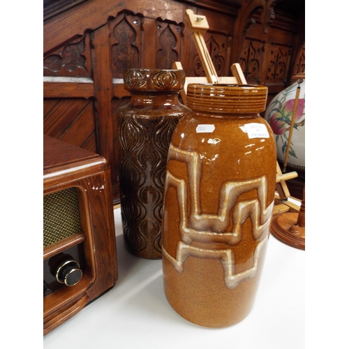 557 - Two West German fat lava brown glazed vases with stylised decoration both A/F