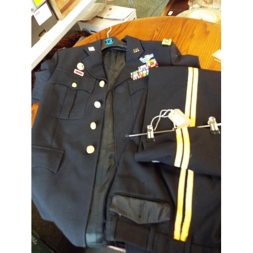 593 - An American officer tunic and trousers with chest ribbons