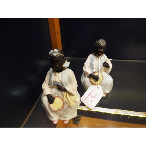 20 - A pair of ceramic nodding female figurines