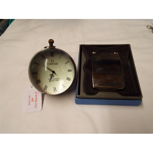 209 - A boxed Wedgwood clock and a glass ball Omega reproduction globe clock