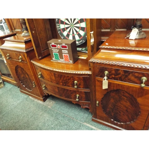 669 - A mahogany bow-front sideboard having two central drawers flanked by two short drawers and cupboards