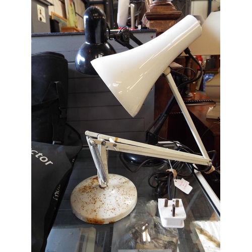 681 - A white painted angle poise lamp together with a black one