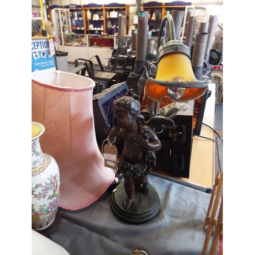 697 - A bronzed cherub figural lamp