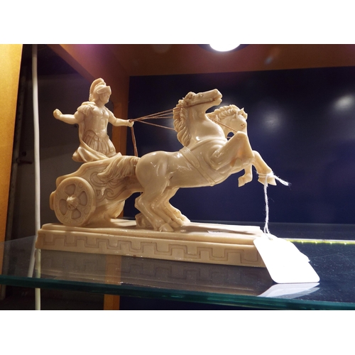 127 - A resin figure of a chariot and horses