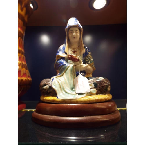 15 - A Japanese porcelain figure of Kannon 'Goddess of Mercy' possibly circa 1910-20's on a later wooden ... 