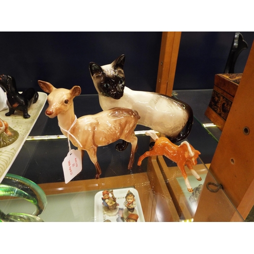 22 - A Beswick Siamese cat, foal and a doe