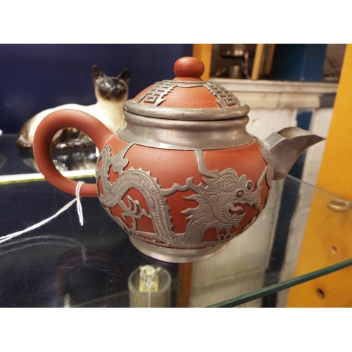 31 - A vintage Chinese tea-pot having white metal mounts signed to base and stamped Shanghai China, A/F