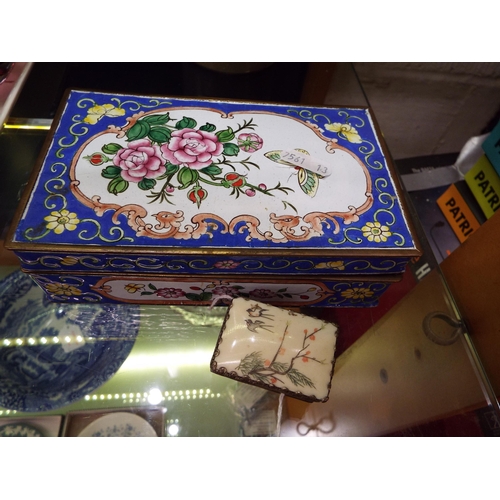 37 - A cloisonné box with floral decoration and an Oriental white metal patch box with internal mirror