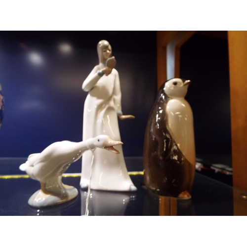 58 - A USSR penguin, a Lladro figure of a goose and another figure