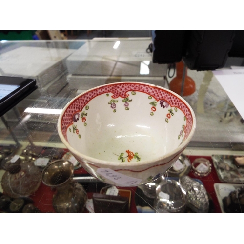 25A - A Victorian Newhall tea bowl with floral decoration