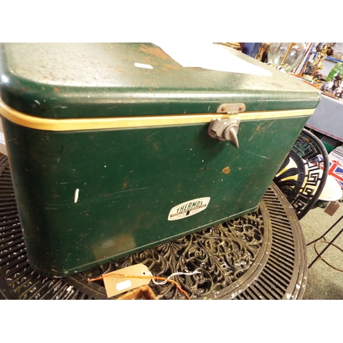 A vintage green Thermos cool box