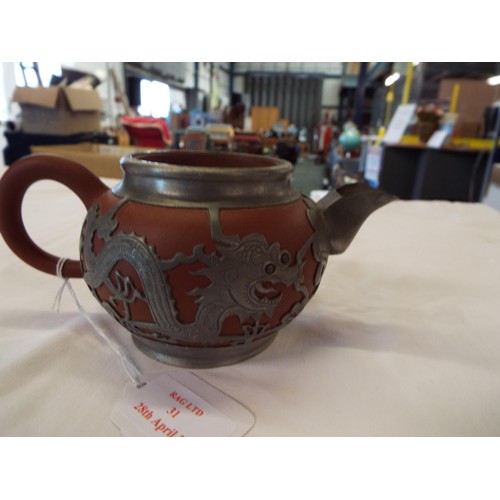 31 - A vintage Chinese tea-pot having white metal mounts signed to base and stamped Shanghai China, A/F