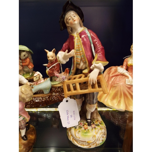 10 - A Saxony porcelain figurine of a gentleman with his hunting catch