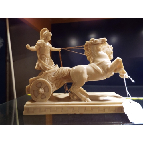 107 - A resin figure of a chariot and horses