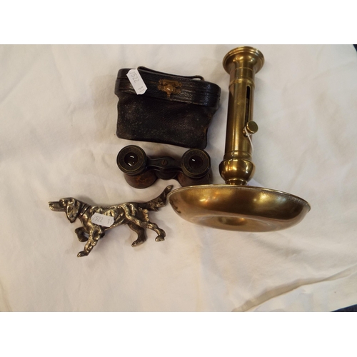 131 - A silver-plated model sporting dog, brass candlestick with ejector and a pair of opera glasses