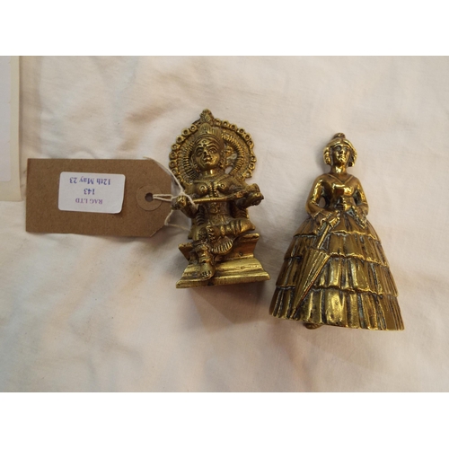 143 - A bronze seated Indian goddess together with a brass lady bell