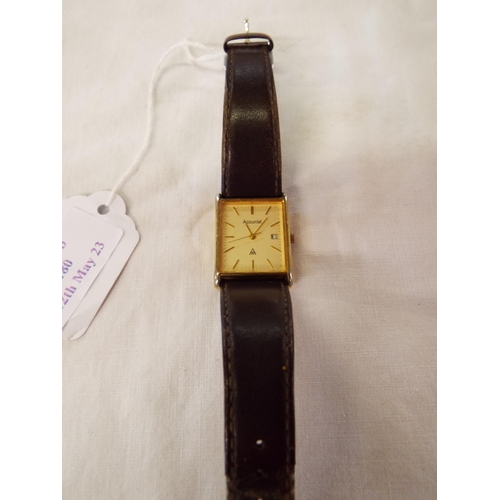 180 - A gents Accurist wristwatch with brown leather strap the dial having date aperture