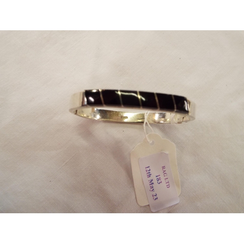 183 - A 925 silver bangle inset with black onyx gemstone