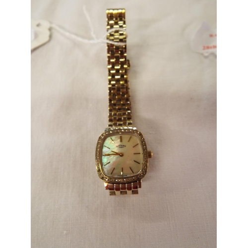 189 - A ladies Rotary wristwatch having mother of pearl dial and Arabic numerals inset with clear stones