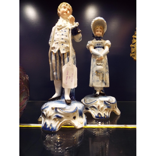 26 - Two Dresden figurines of a male and female marks to base and stamped 277 and 278