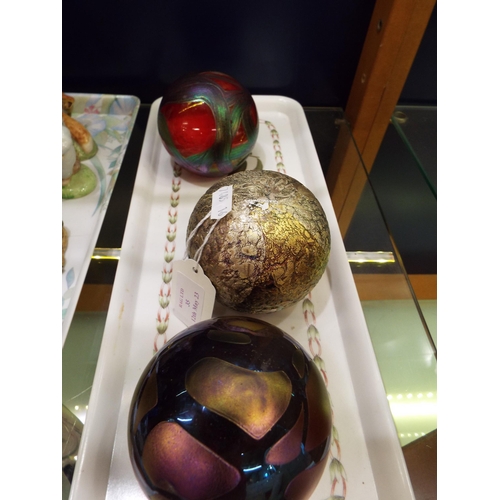 35 - Three iridescent glass paperweights signed to base