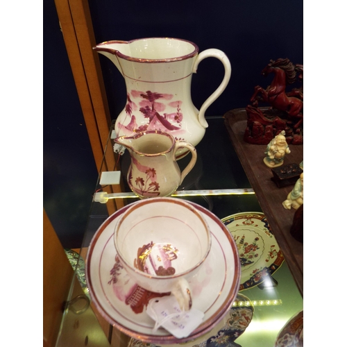 52 - Two Sunderland lustre jugs together with two plates and a coffee cup