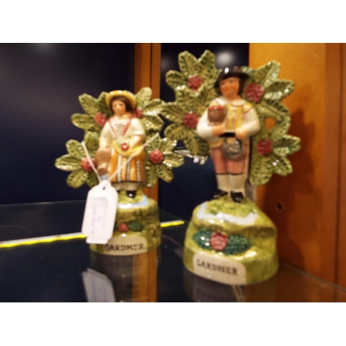 54 - A pair of male and female 'Gardener' figurines