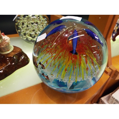 61 - A large Murano glass paperweight with bubble and fish inclusions