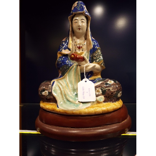 7 - A Japanese porcelain figure of Kannon 'Goddess of Mercy' possibly circa 1910-20's on a later wooden ... 