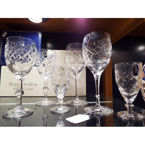 76 - Two boxed Royal Doulton Finest Crystal sherry glasses, two hock glasses and two wine glasses