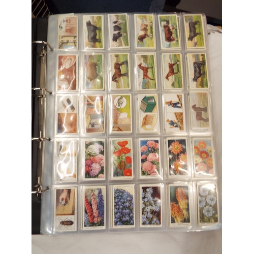 89 - A large binder of assorted cigarette cards