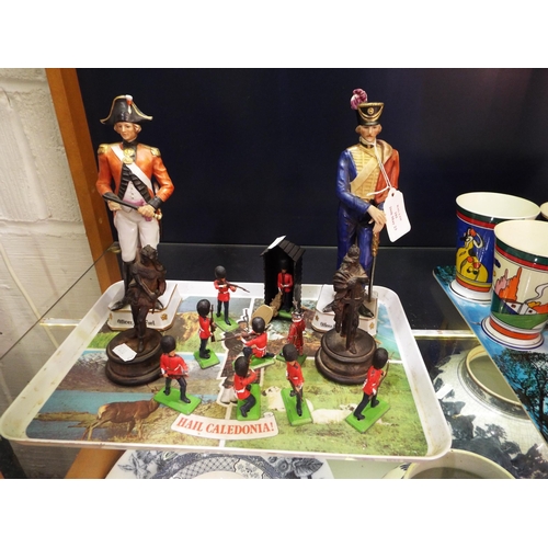 101 - Two porcelain soldier figurines, two cast metal figures and a selection of Britain's soldiers