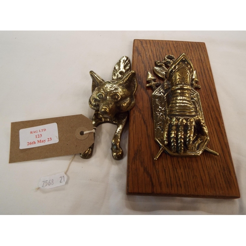 123 - A brass fox door knocker together with a brass gloved hand letter clip