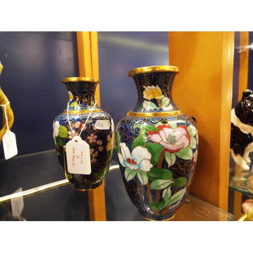 22 - A pair of blue cloisonné vases with flower and blossom decoration