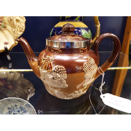24 - A Royal Doulton stone-ware tea-pot having Birmingham silver rim and toper decoration