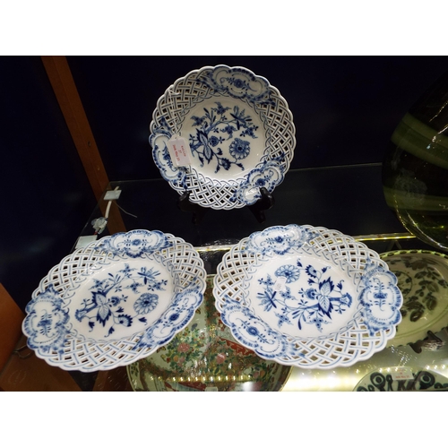 27 - Three Meissen blue and white plates with pierced borders and floral decoration