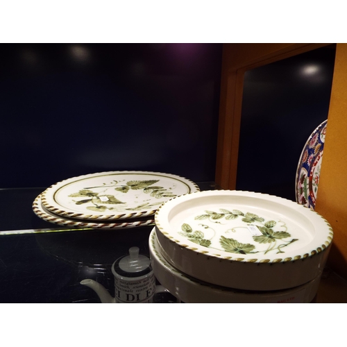 56 - Two Rye pottery dinner plates and two shallow bowls with hop and vine decoration